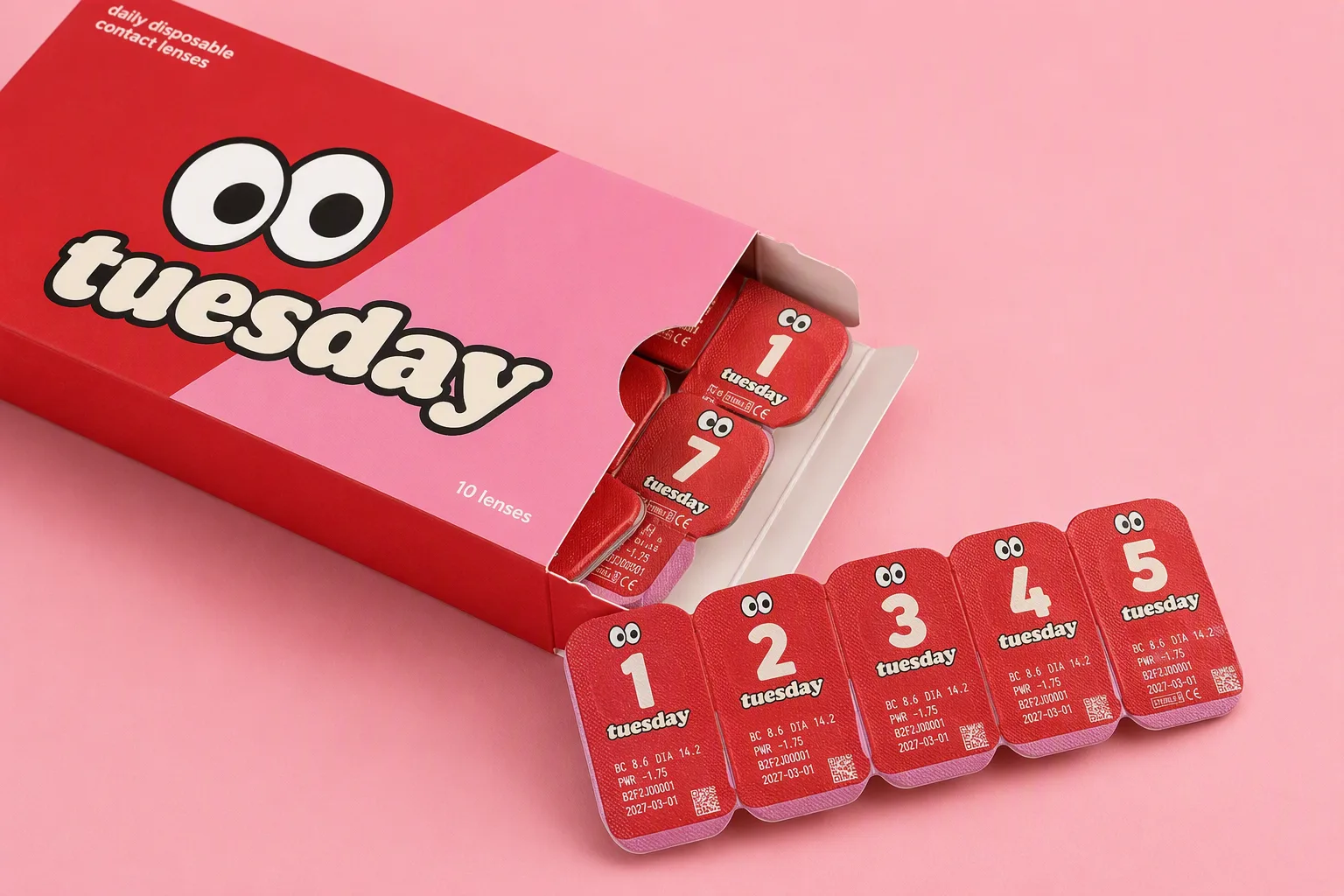 an open cherry cola tuesday box with numbered daily lens blisters fanned out in front